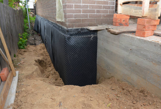 SJ Waterproofing Pros technician performing targeted Sump Pump Installation assessment in Jonesville, MI